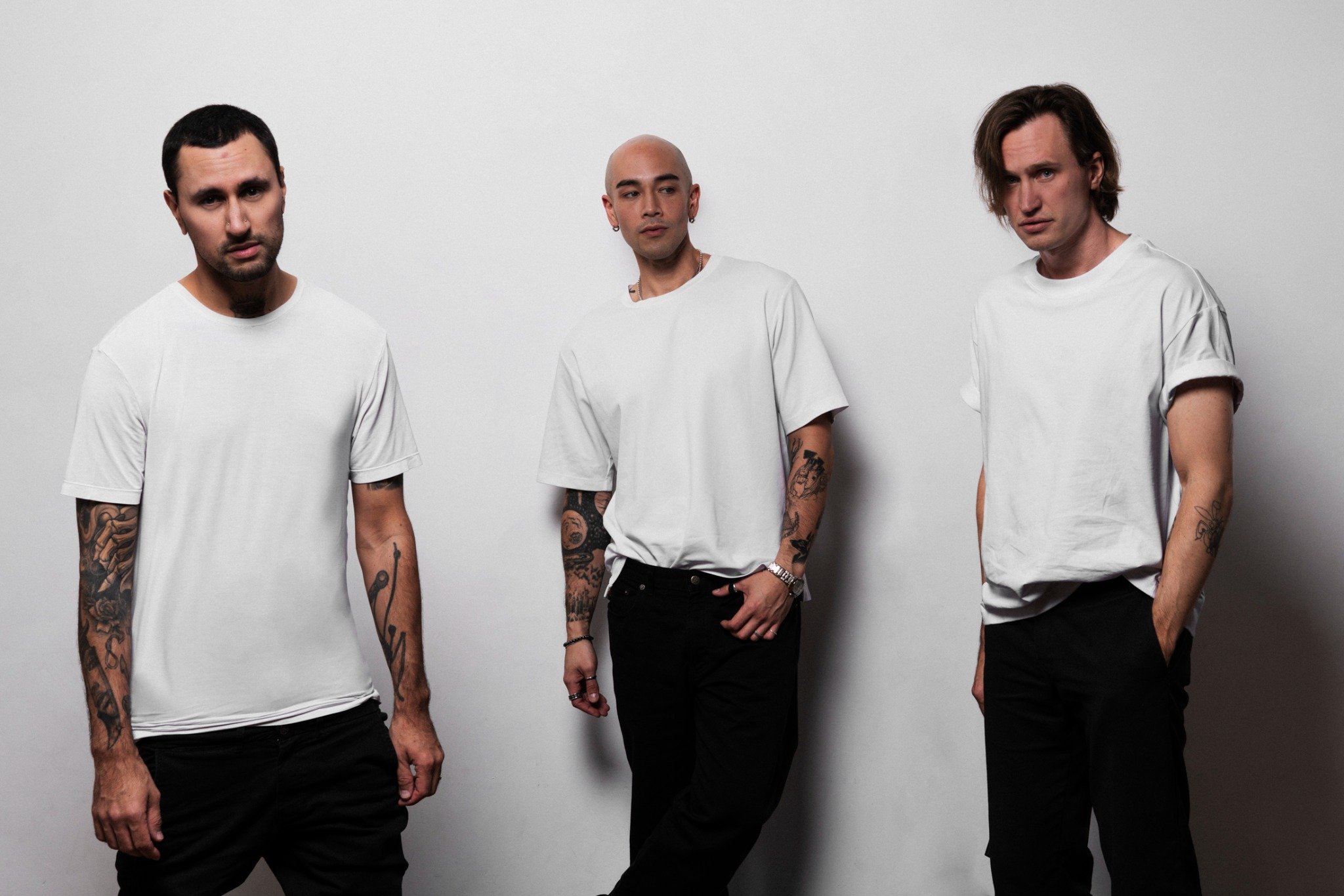 Sorry In Advance band photo against a light studio backdrop